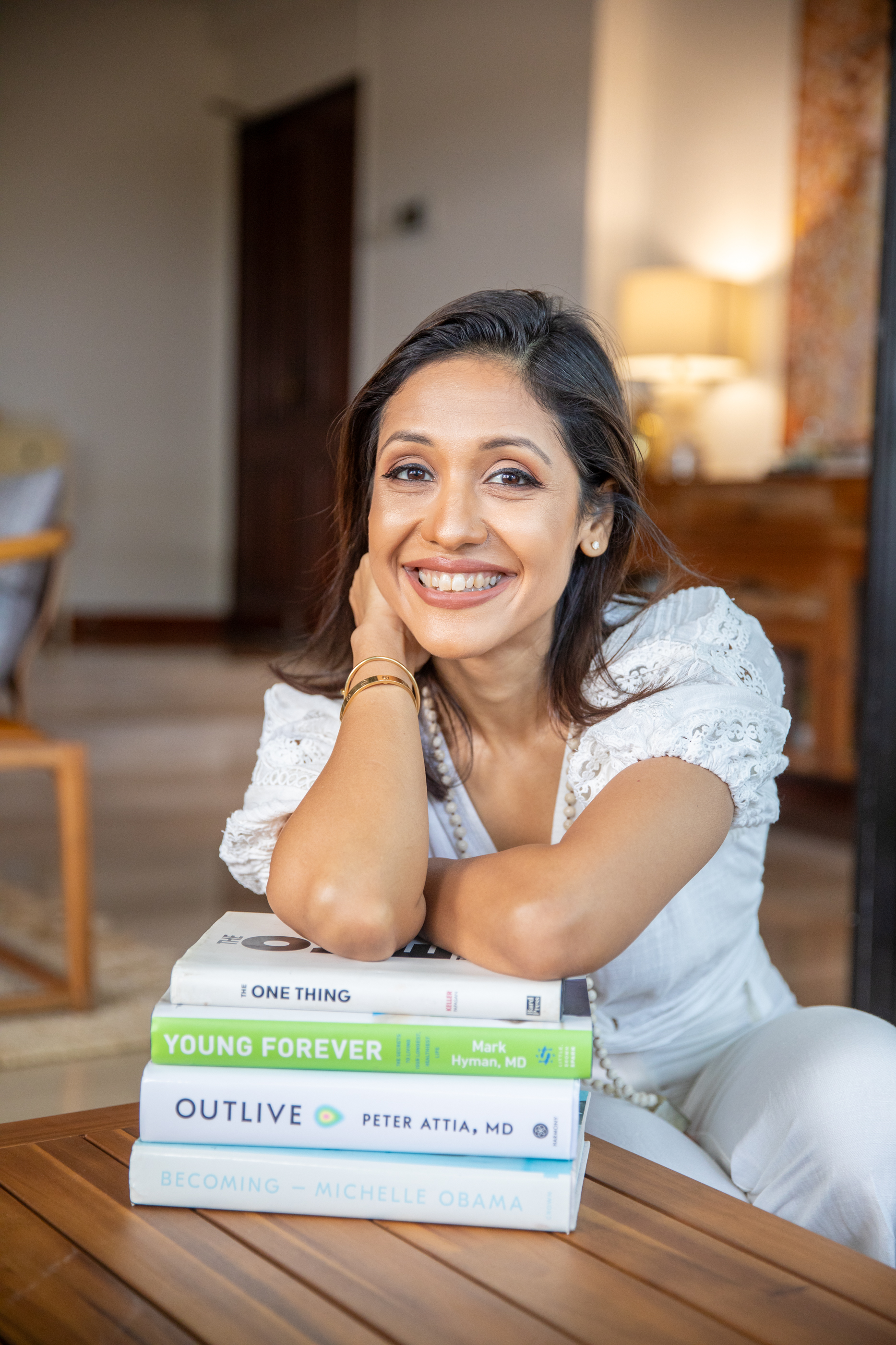 Swati Singh - Holistic Wellness Coach Singapore with health and wellness books